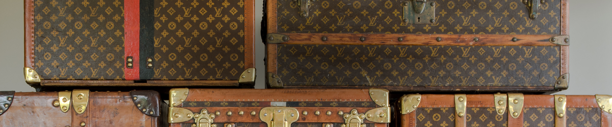 Vintage Omega Speedmaster shoot on top of an old riveted Louis Vuitton  travel case with it's iconic LV pattern Stock Photo - Alamy