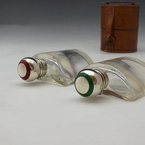 Cased Enamelled Silver Top Bottles