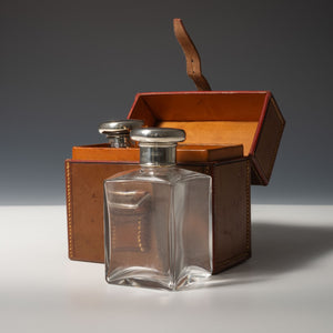 Leather Cased Silver Top Bottles