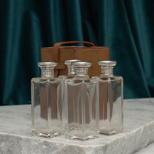 Leather Cased Set of Silver Top Bottles