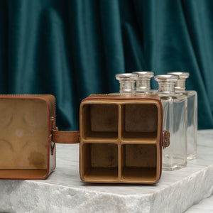 Leather Cased Set of Silver Top Bottles