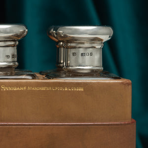 Leather Cased Set of Silver Top Bottles