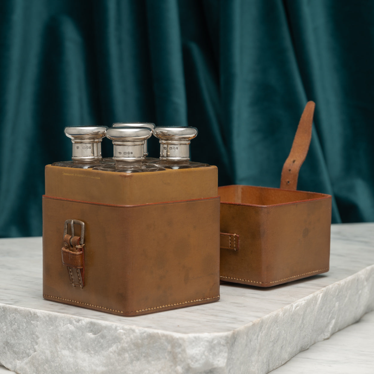 Leather Cased Set of Silver Top Bottles