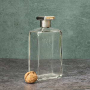 Silver Topped Glass Bottle