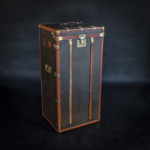An unusual Goyard wardrobe trunk with original chevron pattern canvas covering, brass fittings and original cotton lined interior providing hanging space. 