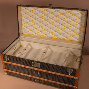A stunning Goyard Steamer trunk with original chevron pattern canvas covering, brass catches and handles. The interior has the original lining and an original tray