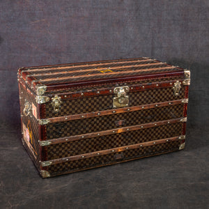 A GRAPHITE DAMIER CANVAS COURRIER 110 STEAMER TRUNK WITH SILVER
