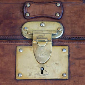 A leather Goyard steamer trunk with brass lock & catches and original interior lining.