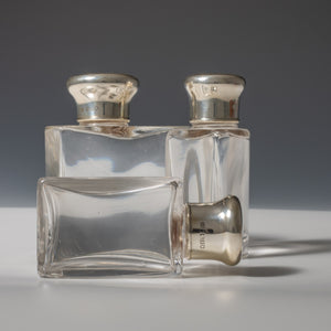 Leather Cased Silver and Enamel Top Bottles