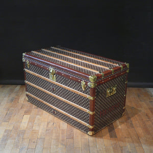 A courier trunk by Louis Vuitton